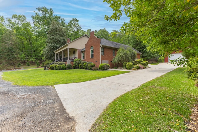 165 Indian Valley Ln, Swansea, SC 29160 - view of side of property with a yard, a chimney, driveway, covered porch, and brick siding
