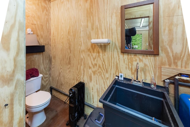 165 Indian Valley Ln, Swansea, SC 29160 - half bathroom with toilet, a sink, and wood finished floors