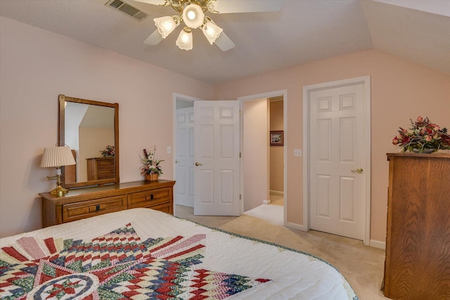 bedroom featuring ceiling fan, lofted ceiling, and light carpet