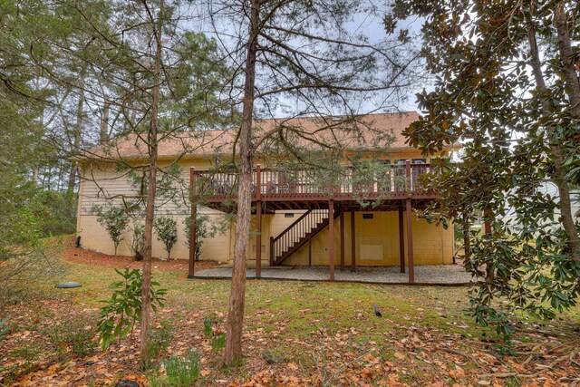 rear view of property with a wooden deck