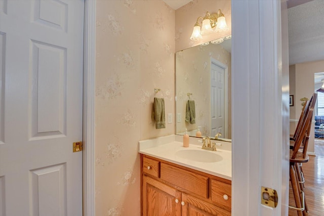 bathroom featuring vanity and a textured ceiling