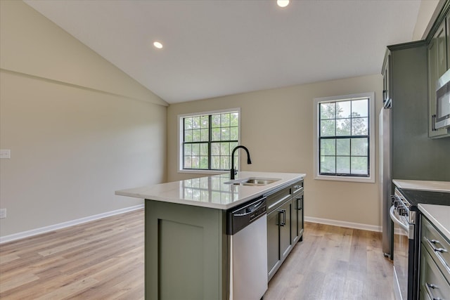 3022 Shady Ln, Hephzibah, GA 30815 - kitchen featuring stainless steel appliances, a sink, light wood-type flooring, light countertops, and an island with sink