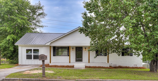 3022 Shady Ln, Hephzibah, GA 30815 - view of front facade with crawl space, a front yard, brick siding, and covered porch