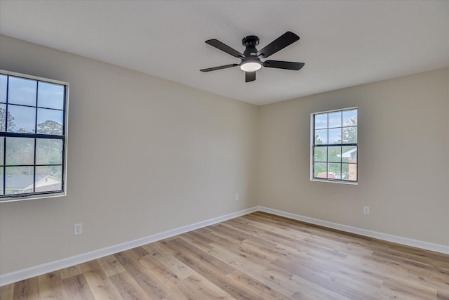 3022 Shady Ln, Hephzibah, GA 30815 - spare room featuring light wood-style floors, a ceiling fan, and baseboards