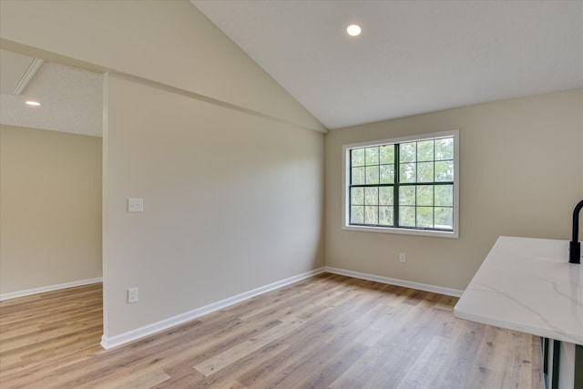 3022 Shady Ln, Hephzibah, GA 30815 - spare room with light wood-type flooring, baseboards, vaulted ceiling, and recessed lighting