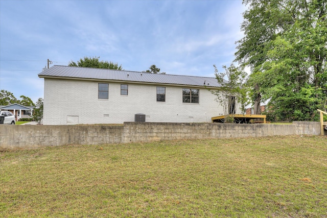 3022 Shady Ln, Hephzibah, GA 30815 - rear view of house with metal roof, cooling unit, and brick siding