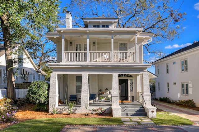 view of front of home with covered porch and a balcony