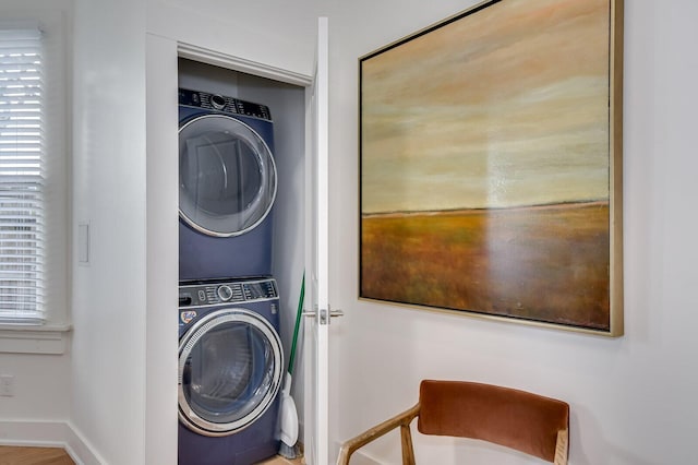 laundry room featuring stacked washer / dryer