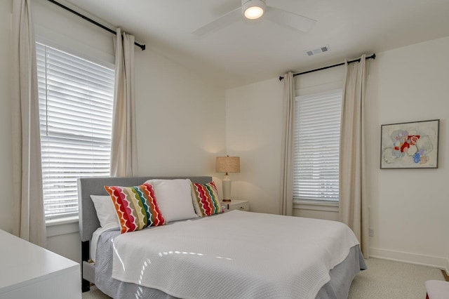 bedroom featuring ceiling fan and light colored carpet