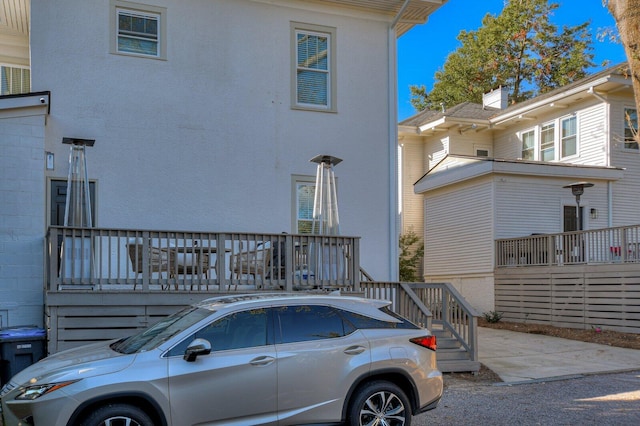 view of side of property with a deck