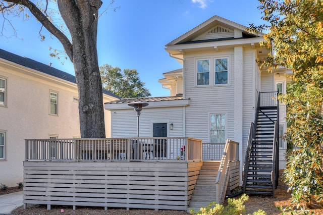 rear view of property with a deck