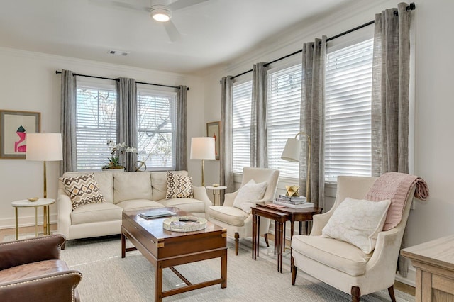 living room featuring ceiling fan and ornamental molding