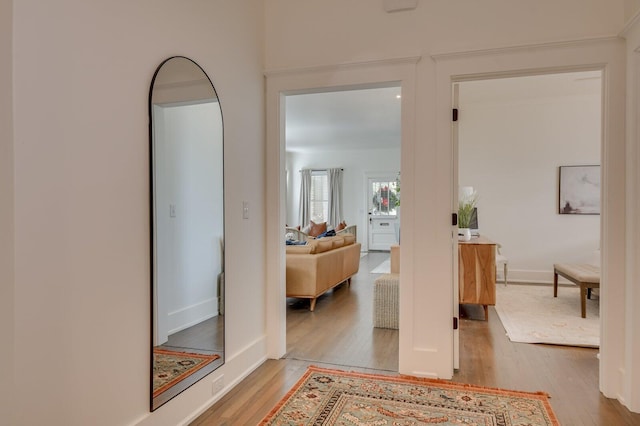 corridor with light wood-type flooring