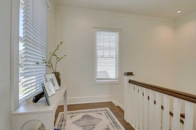 office area with dark wood-type flooring, a wealth of natural light, and ornamental molding