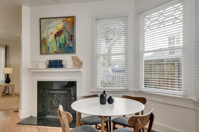 dining space with hardwood / wood-style flooring