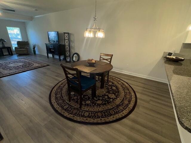 dining space featuring dark hardwood / wood-style floors