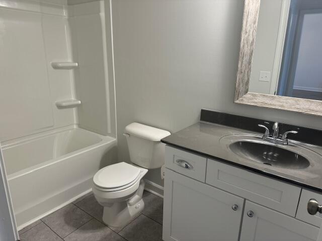 full bathroom featuring tile patterned flooring, vanity, toilet, and tub / shower combination