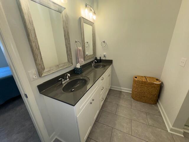 bathroom with tile patterned flooring and vanity