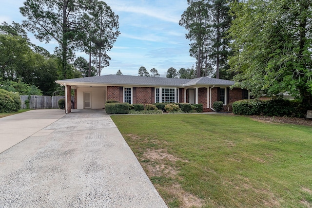 ranch-style house featuring a front yard and a carport