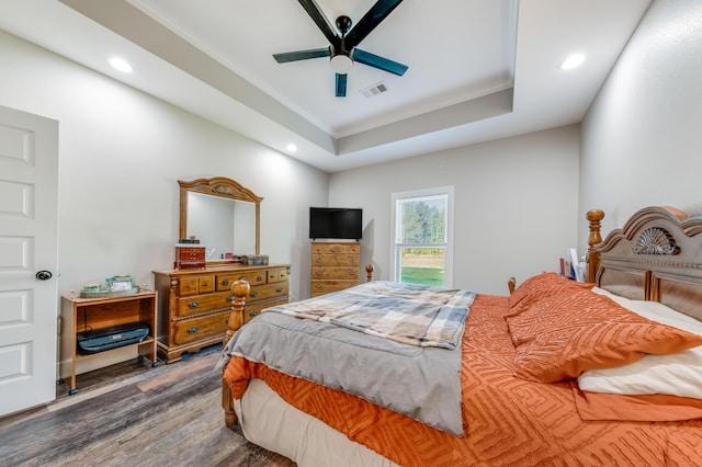 bedroom with visible vents, wood finished floors, ornamental molding, and recessed lighting