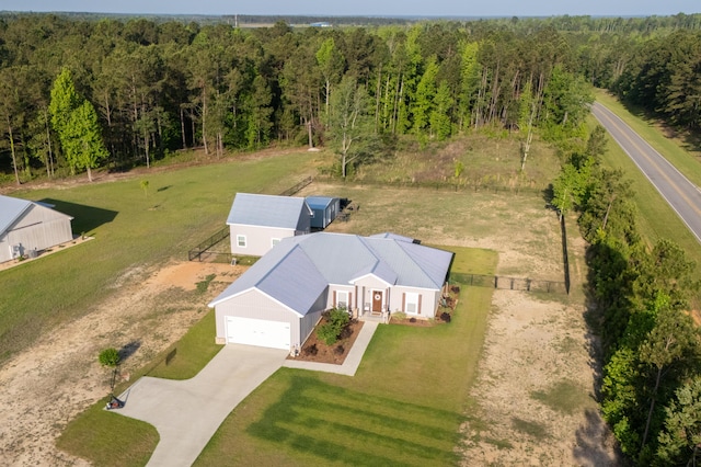 bird's eye view featuring a wooded view