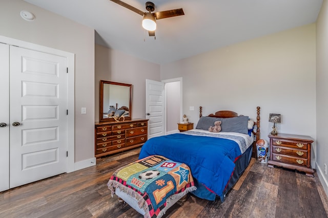bedroom featuring ceiling fan, baseboards, and wood finished floors
