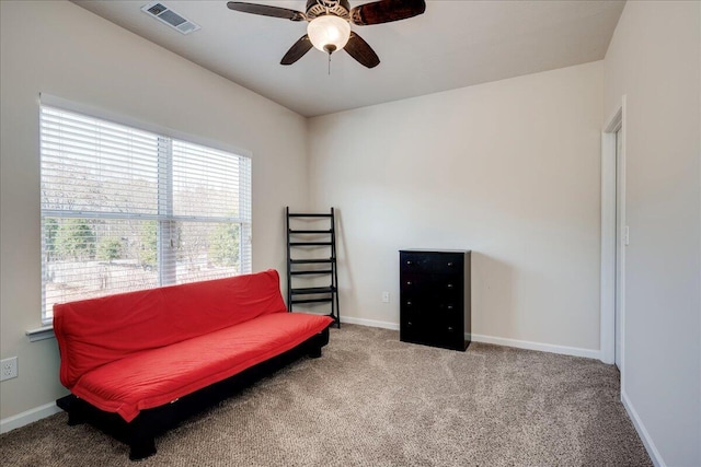 sitting room with carpet flooring and ceiling fan