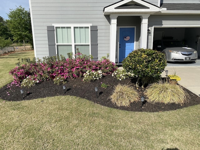 doorway to property with a yard