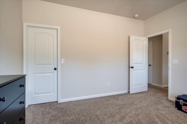 unfurnished bedroom featuring light carpet