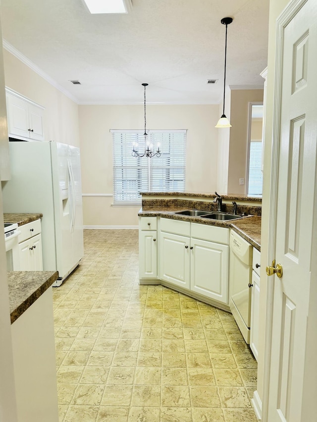 561 Farmington Cir, Evans, GA 30809 - kitchen with white appliances, ornamental molding, white cabinets, a chandelier, and hanging light fixtures