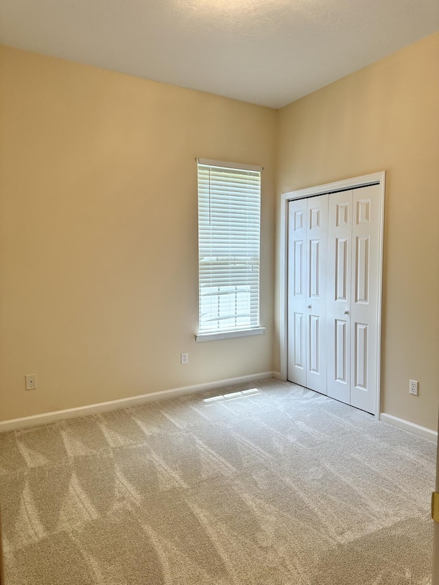 561 Farmington Cir, Evans, GA 30809 - unfurnished bedroom featuring carpet and a closet