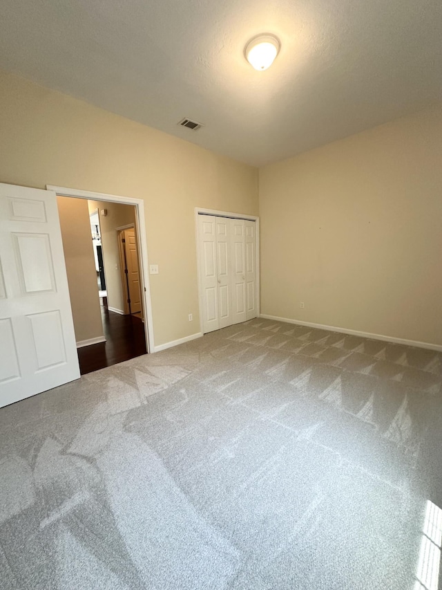 561 Farmington Cir, Evans, GA 30809 - unfurnished bedroom with carpet floors and a closet