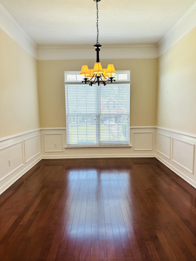 561 Farmington Cir, Evans, GA 30809 - unfurnished dining area featuring a chandelier, healthy amount of natural light, dark wood-type flooring, a wainscoted wall, and a decorative wall