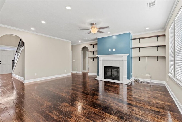 1717 Ethan Way, Hephzibah, GA 30815 - unfurnished living room featuring arched walkways, recessed lighting, a ceiling fan, a tile fireplace, and wood finished floors