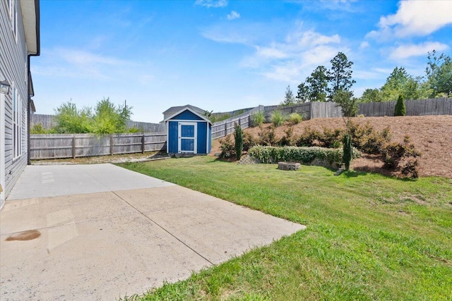 1717 Ethan Way, Hephzibah, GA 30815 - fenced backyard featuring a shed, a patio area, and an outdoor fire pit