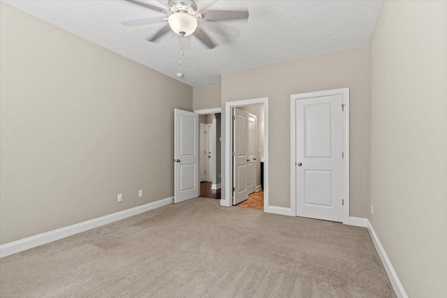 1717 Ethan Way, Hephzibah, GA 30815 - unfurnished bedroom with light carpet, ensuite bath, and ceiling fan