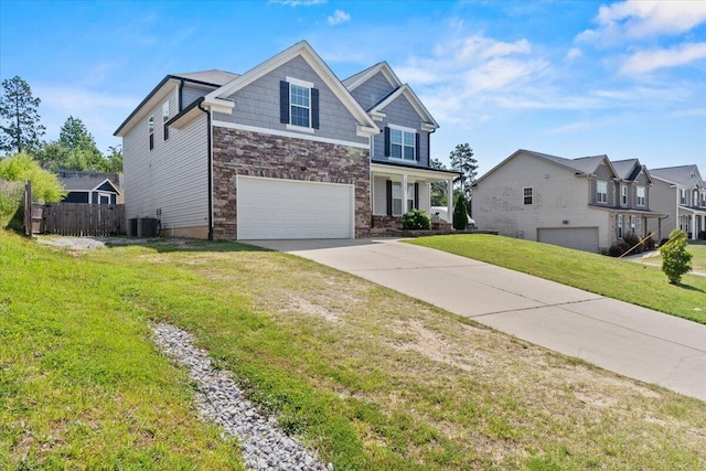 1717 Ethan Way, Hephzibah, GA 30815 - craftsman-style home with a garage, driveway, and stone siding