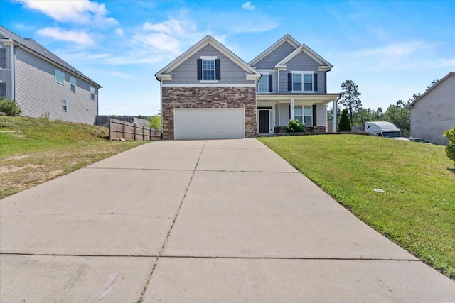 1717 Ethan Way, Hephzibah, GA 30815 - craftsman inspired home with an attached garage, stone siding, concrete driveway, and covered porch