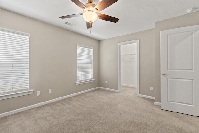 1717 Ethan Way, Hephzibah, GA 30815 - unfurnished bedroom featuring carpet, a spacious closet, multiple windows, and a closet