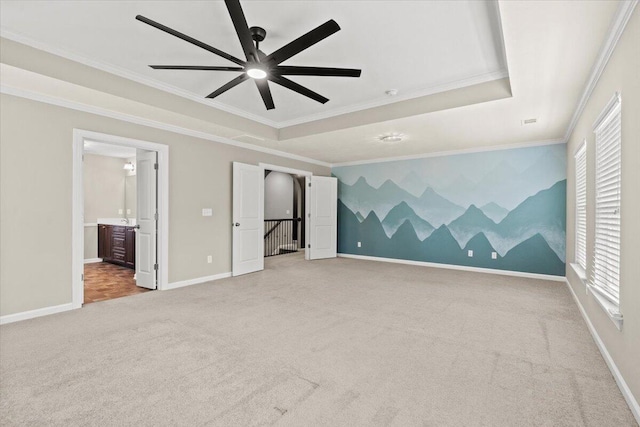 1717 Ethan Way, Hephzibah, GA 30815 - unfurnished bedroom featuring carpet flooring, multiple windows, crown molding, a raised ceiling, and connected bathroom