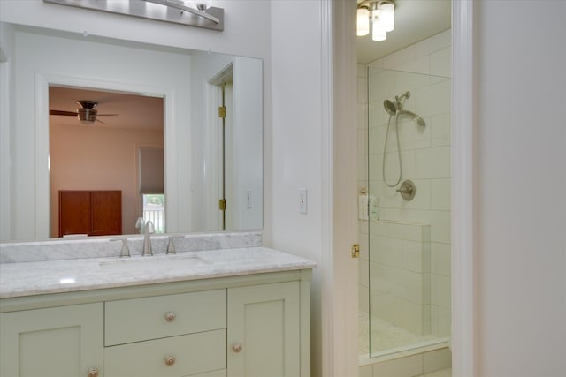 bathroom featuring a shower stall and vanity
