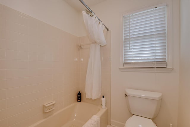 full bathroom featuring shower / bath combo and toilet