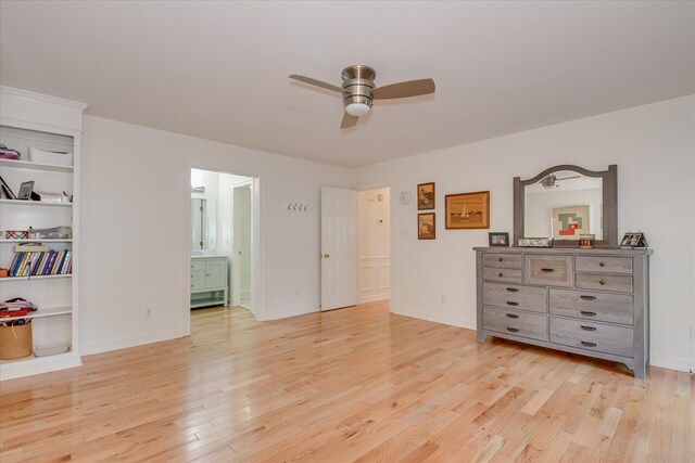 bedroom featuring ceiling fan, connected bathroom, and light wood finished floors