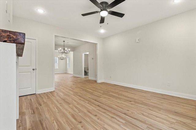 1227 Miller St, Augusta, GA 30901 - spare room featuring light wood-type flooring, a chandelier, baseboards, a ceiling fan, and recessed lighting