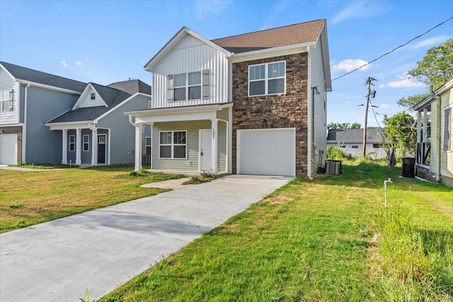 1227 Miller St, Augusta, GA 30901 - view of front of home featuring board and batten siding, an attached garage, stone siding, driveway, and a front yard