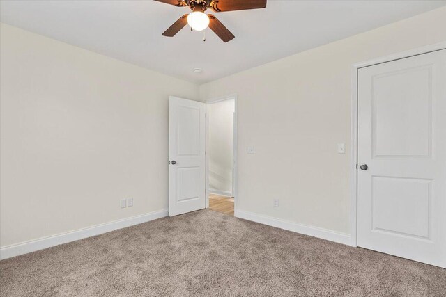 1227 Miller St, Augusta, GA 30901 - unfurnished bedroom with light carpet, baseboards, and ceiling fan