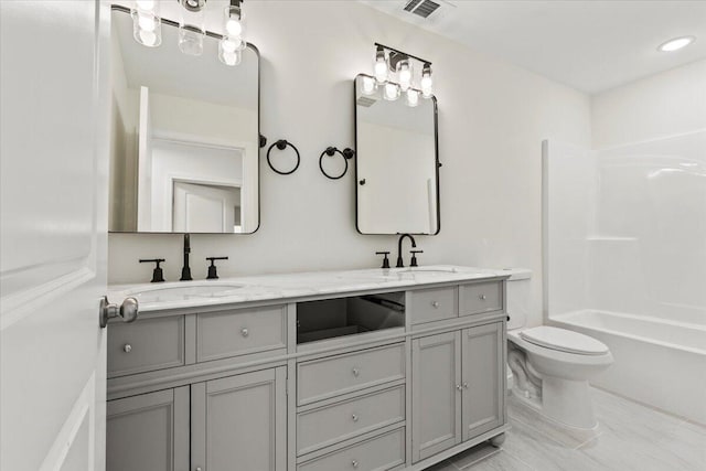 1227 Miller St, Augusta, GA 30901 - full bathroom with double vanity, toilet, and shower / washtub combination