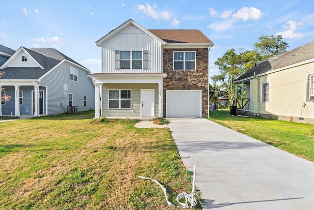 1227 Miller St, Augusta, GA 30901 - traditional home with board and batten siding, concrete driveway, central air condition unit, an attached garage, and a front yard