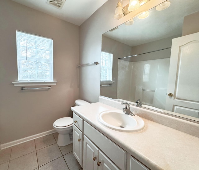 full bathroom with a wealth of natural light, visible vents, toilet, and tile patterned floors