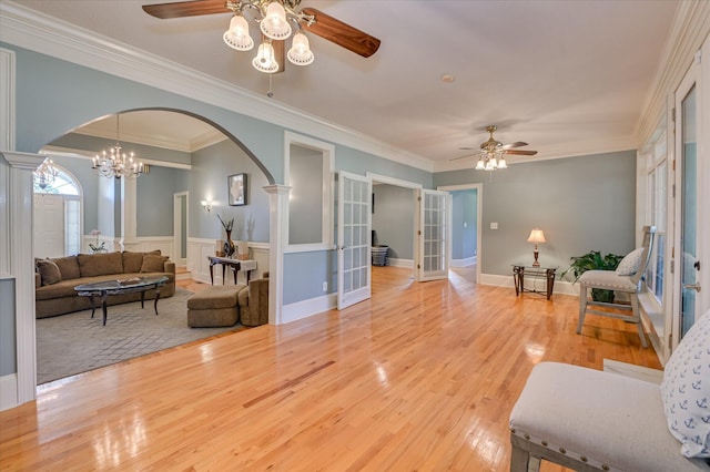 3953 Bolton St, Augusta, GA 30909 - living area featuring a ceiling fan, arched walkways, french doors, light wood finished floors, and crown molding